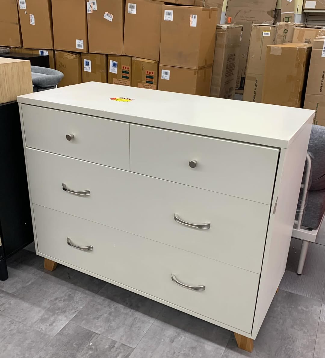 White four-drawer dresser at ABC Home Outlet