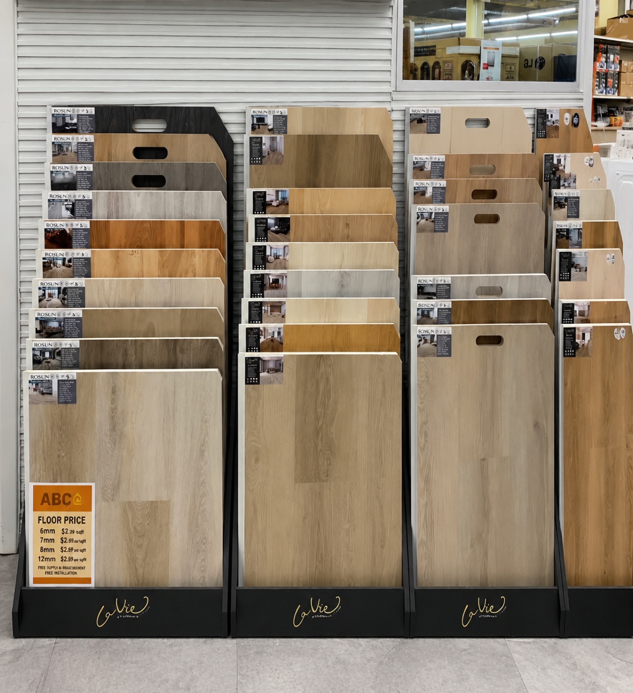 ABC Home Outlet vinyl plank flooring display rack with floor-price sign