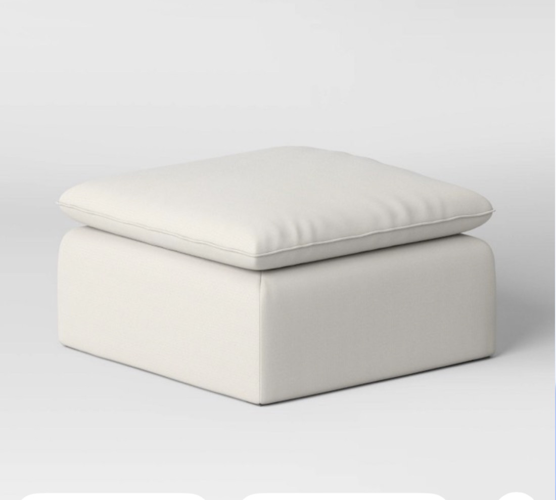 Cream canvas modular sofa ottoman with French-seam upholstery
